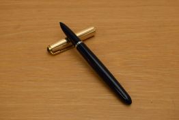 A Parker 51 MKII aerometric fill fountain pen in navy blue with rolled gold cap.