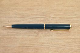 A Parker Duofold propelling pencil in green with single gold chevron cap band