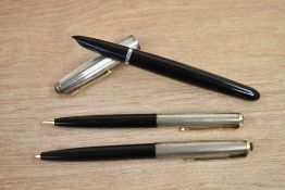 A boxed Parker 51 aerometric fill fountain pen, propelling pencil and ballpoint pen in black with