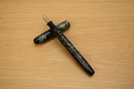 A Parker Televisor Slender button fill fountain pen in lined green with three gold cap bands