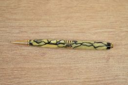 A Parker Duofold pencil in black and pearl with three gold bands to the cap.
