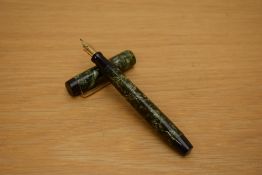 A Parker Victory button fill fountain pen in green lined pattern with bandless cap having a Parker