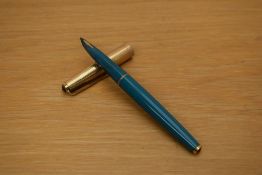A Parker 61 Consort capillary fill fountain pen in turquoise with rolled gold cap