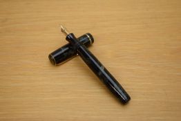 A Parker Premiere button fill fountain pen in blue black marble with single gold cap band having