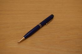 A Parker Duofold pencil in lapis lazulii with two gold bands to the cap.