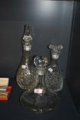 A late 20th Century clear glass ship's decanter and stopper, with etched inscription and measuring