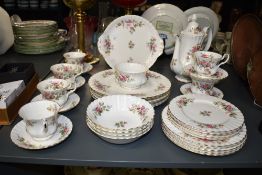 A Royal Albert fine bone china tea service, decorated with gilt edging and foliage on an ice white