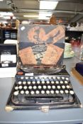 An early 20th century Remington portable typewriter featuring both £ and Rupee keys. The box