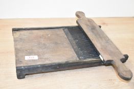 A 19th century brass-mounted pill rolling machine, measuring 36cm long