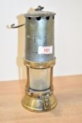 A vintage brass miners lamp, labelled 'British' to glass, h22cm Condition: damage to glass.