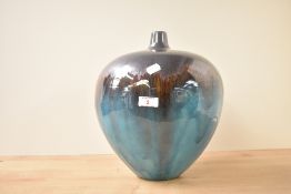 A large globular studio pottery vase, decorated in deep turquoise and bronze metallic glaze, h32cm.