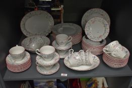 A Johnson Brothers fine bone china tea service, decorated with foliage and pink edging on a white