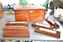 A selection of vintage mahogany desk / board meeting name plates, sold together with box, w39cm