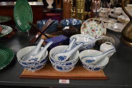 An early 20th century Chinese dish hand coloured in the famille rose pattern with four character