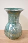 An early 20th century Ruskin pottery art vase, having flared rim over alabuster body, decorated in