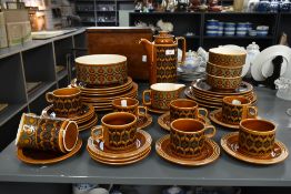 A retro Hornsea Heirloom tea service, decorated with psychedelic patterns on a brown glazed