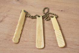 Three early 20th century bone teething sticks, L8cm
