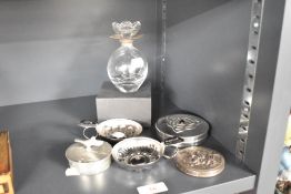 A 20th century bulbous shaped glass perfume bottle with hallmark silver rim and floral style