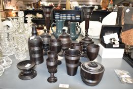 A good selection of 19th century black forrest treen ware, decorated with thread patterns, to