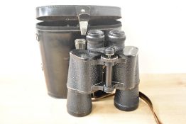 A single pair of binoculars with leather strap, factory mark '7x50 MADE IN USSR', suede lined
