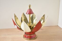 A 1950's enamel cigarette dispenser in the form of a flower head with articulated action, 22cm.