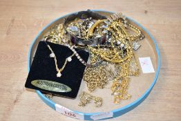 An assortment of costume jewellery, including yellow metal chains and bracelets
