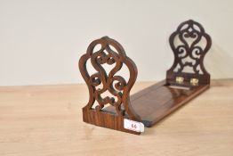 A Victorian rosewood book slide with fret-cut ends, closed L 32cm x open L53cm.