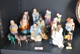 A group of 20th century Chinese porcelain figures, various to include two mud men figures one with