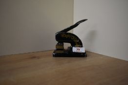 An early / mid 20th century metal letterhead press decorated with gilt scrolls, when pressed it