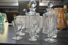 A pair of cut crystal decanters with the initials J.M.M, h26cm, sold together with a selection of