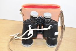 A pair of Zenith 7 x 50 coated optic triple tested binoculars with original leather case, h19cm.