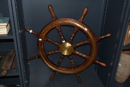 A heavy vintage mahogany and brass nautical ship wheel, w86cm