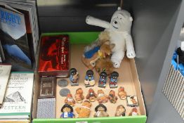 A collection of pin badges, playing cards and miniature toys, to include Paddington Bear, Basil