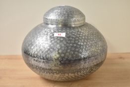 A contemporary hand beaten white metal Indian vase in globular form, factory sticker to base '