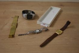 A selection of four wristwatches, including BMW, Roamer, Sekonda and a silver marcasite example
