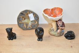 A rare German garden gnome figure sheltering under a mushroom, h8cm, sold together with three