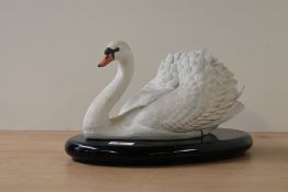 A Ronald Van Ruyckevelt for The Franklin Mint 'The Royal Swan' bisque porcelain bird study raised on