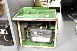 A vintage paper testing instrument in original case, plaque inside reading; instrument serial No S.