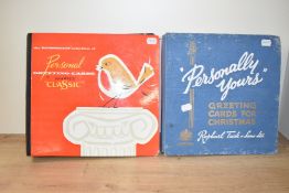 Two scrap books by Raphael Tuck & Sons and Sharps Classic, inside showcasing a wonderful