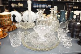 A selection of cut glass items comprising fruit bowl, biscuit barrel and decanters etc.