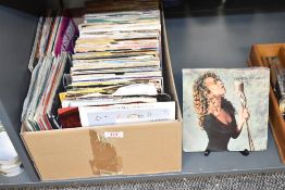 A box of mixed genre 7' singles, to include Mariah Carey vision of life, Fleetwood Mac, Baccara ect,