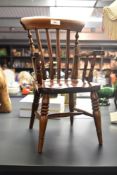 A vintage miniature Windsor armchair with part turned spindle back and legs, h40cm. Condition: In