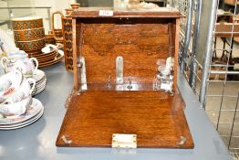 A late 19th / early 20th century oak cased fall front stationary box / writing case, complete with