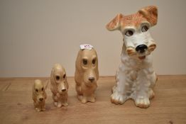 A large Sylvac Terrier Dog number 1380 measures 29cm tall sold together with three sad-faced beige