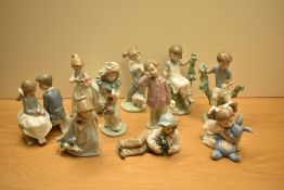 An assortment of Nao by Lladro porcelain figurines comprising 'First Love' No 1136, 'Girl Running