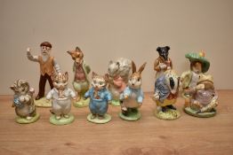 A group of eleven Beswick Pottery and Royal Albert bone china Beatirx Potter figures comprising
