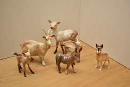 A small collection of Beswick Pottery, comprising a goat, number 1035, designed by Arthur Gredington