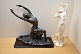 A large cast patented metal figural study of a woman in a knelt position sold together with a cast