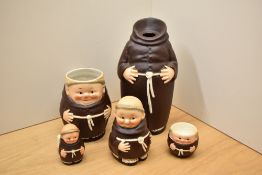 A selection of Goebel porcelain monks comprising egg cup, mug, condiment pot etc.