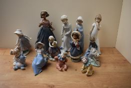 An assortment of Lladro and Nao by Lladro porcelain figures including 'Jingles' number 1065, 'Keep